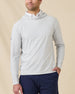 Model wearing the Hermosa Hoodie in Silver layered over a white polo