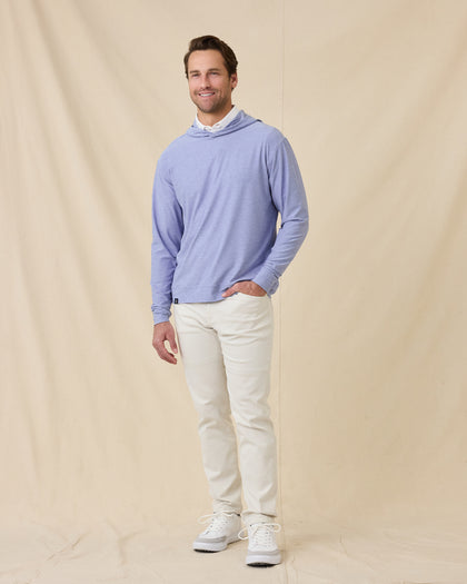 Model styled in the Hermosa Hoodie in Tidal Blue with white pants
