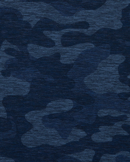 A close-up of a textured fabric with a dark blue camouflage pattern in multiple shades of navy and blue.