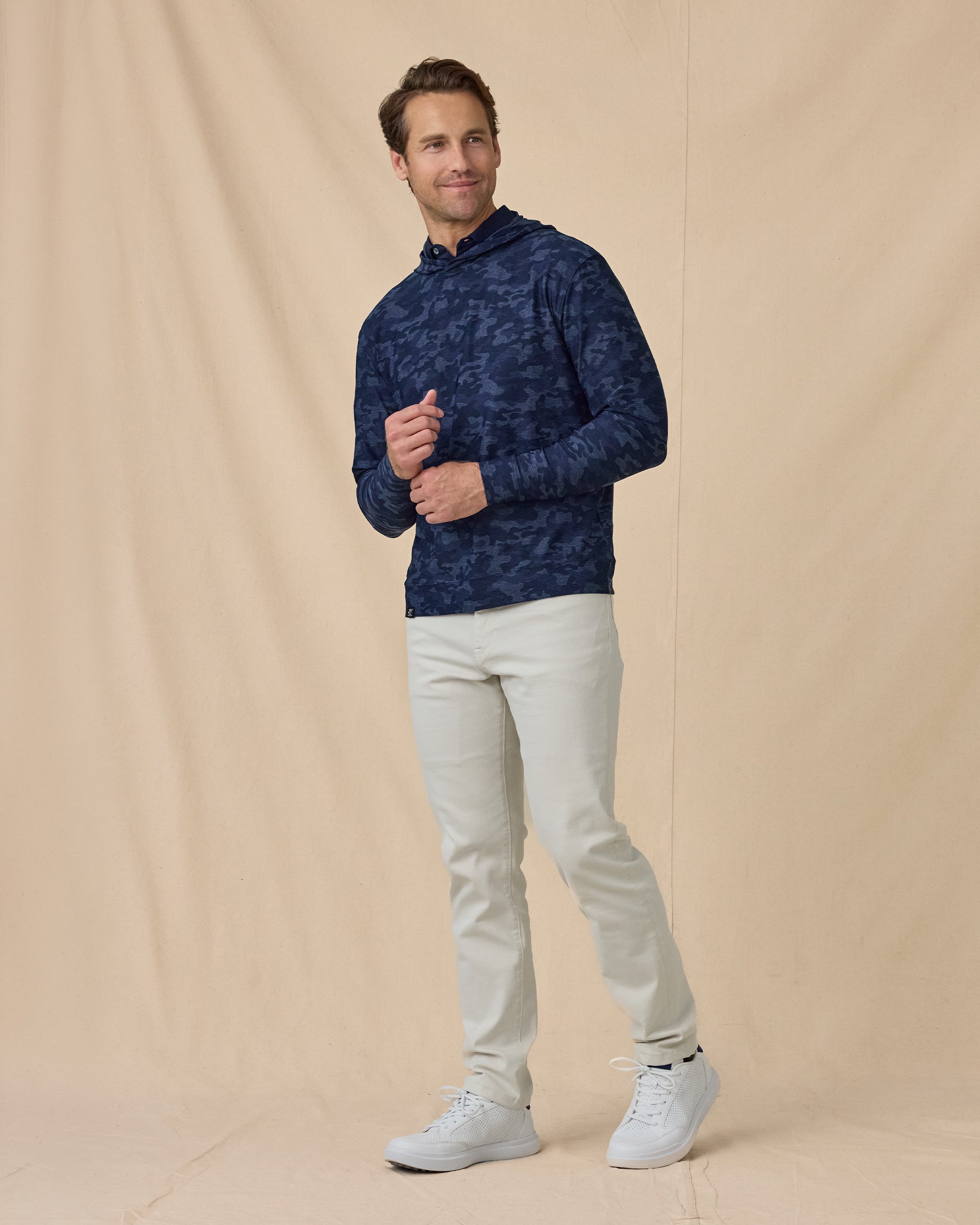 Men’s Commander Hoodie in New Indigo camouflage print, styled full outfit view with light pants