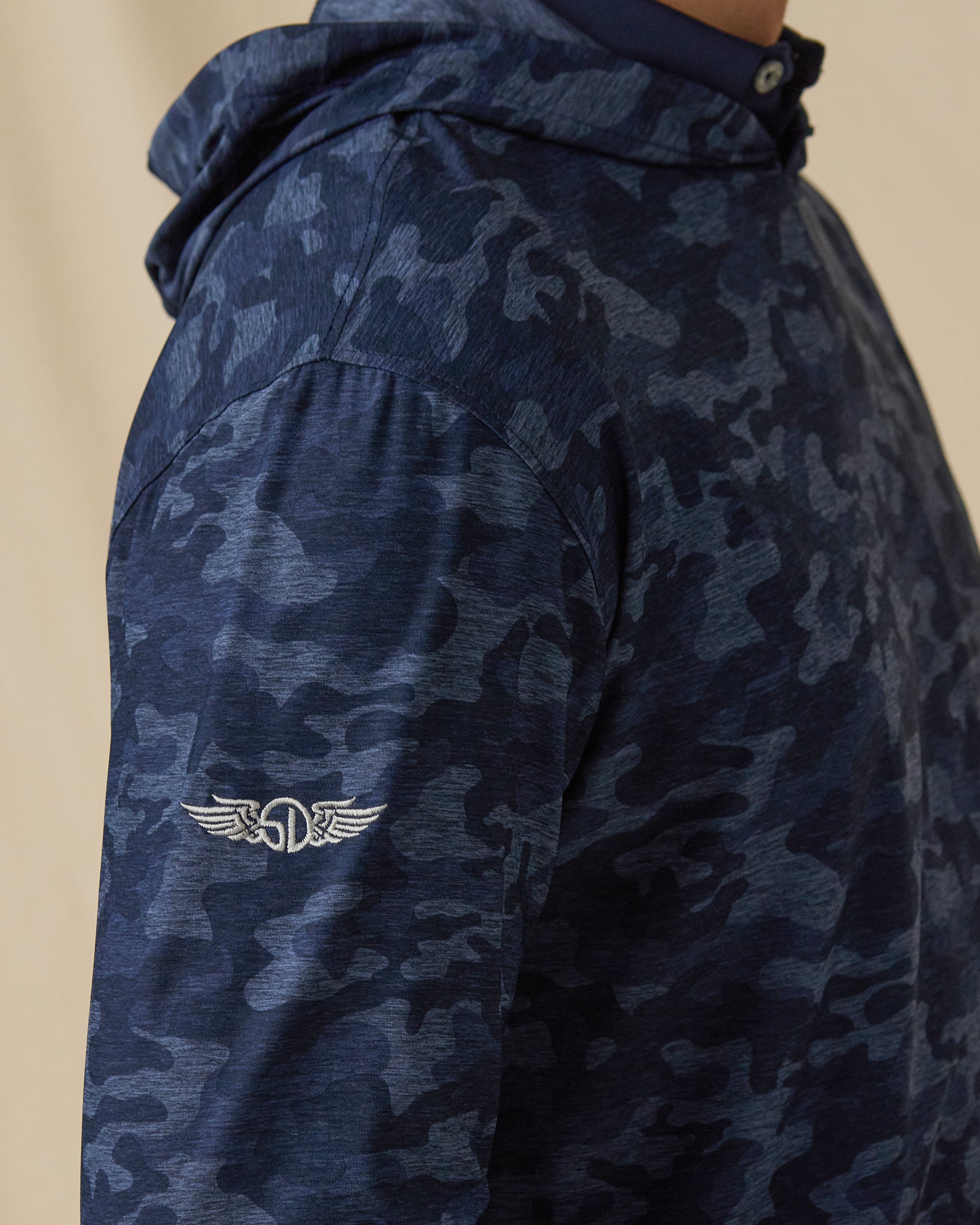 Commander Hoodie in New Indigo camouflage print, sleeve logo detail close-up