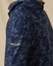 Commander Hoodie in New Indigo camouflage print, sleeve logo detail close-up