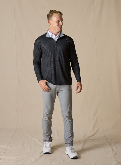 Sherman Quarter Zip in Black styled with light gray pants and white sneakers