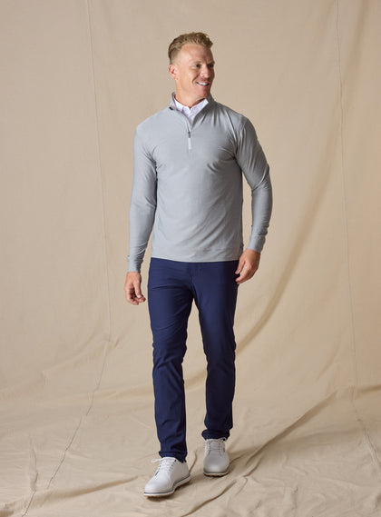 Oceanside 2.0 Quarter Zip in storm grey, full outfit layered over light polo and styled with navy pants