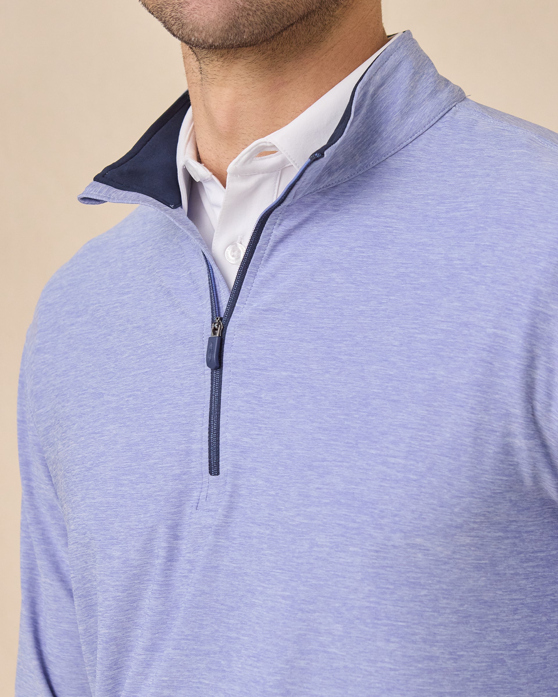 Close-up of the Oceanside 2.0 Quarter Zip in Tidal Blue featuring a contrast-lined collar, quarter-zip placket, and soft heathered performance fabric