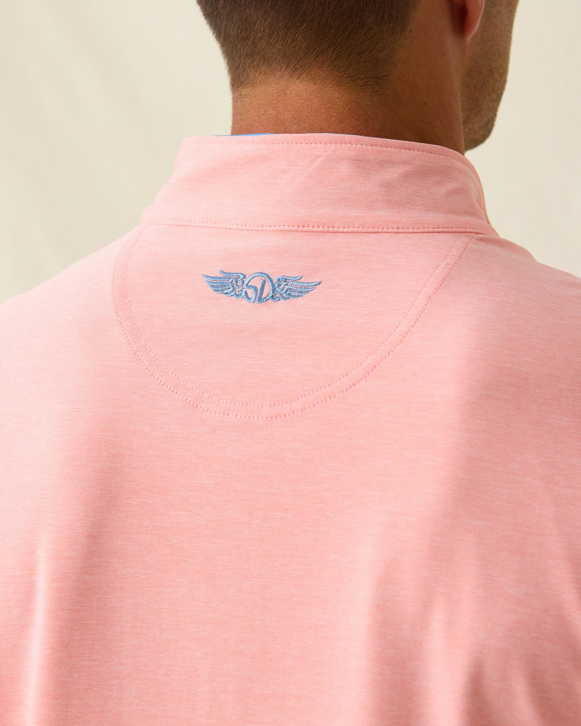 Oceanside 2.0 Quarter Zip in spritz orange, back logo detail