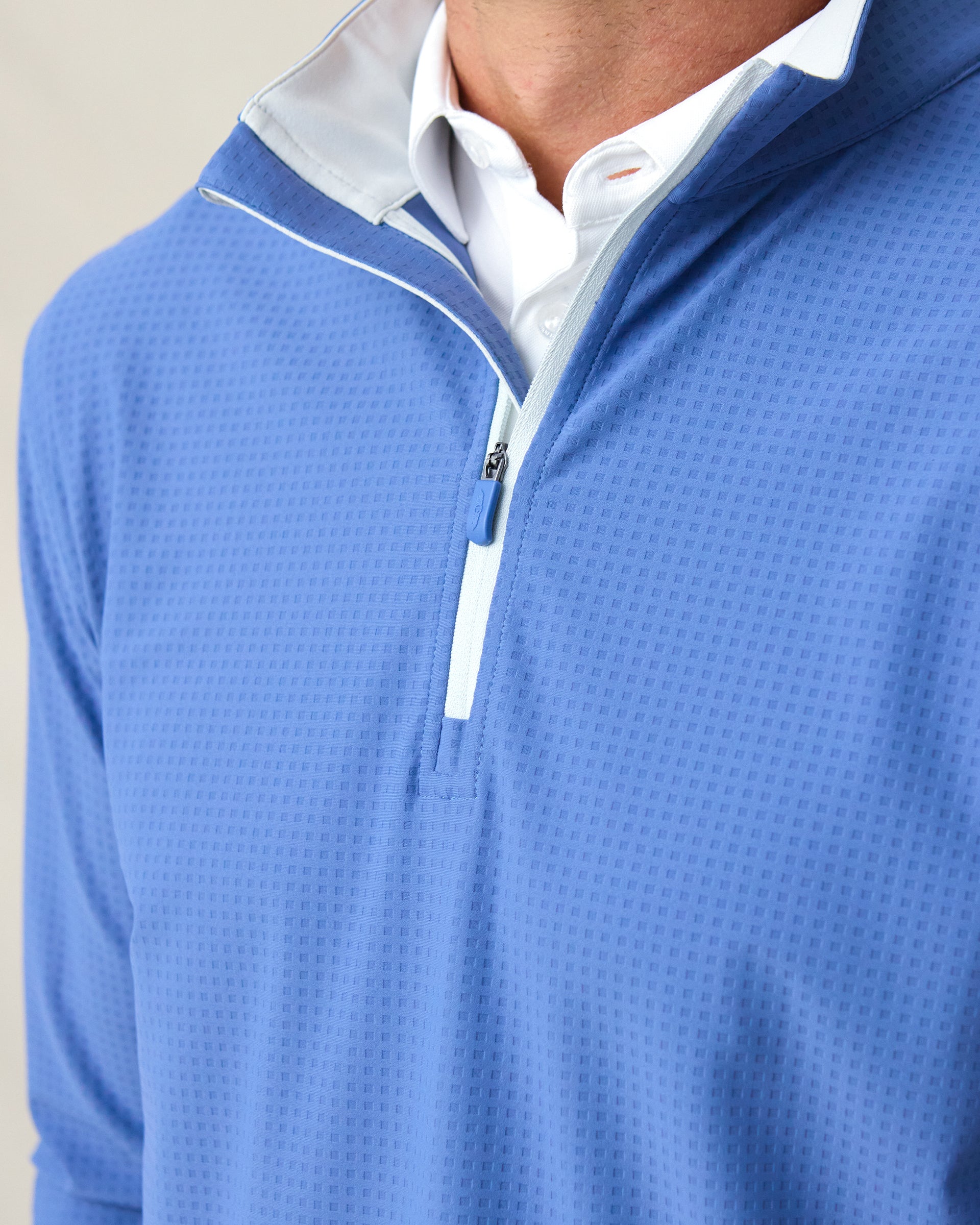 Men's Bel Air Quarter Zip in Moonlight, close-up front view on model highlighting the grid-textured jersey knit and light gray quarter zip placket with white polo collar visible at neckline