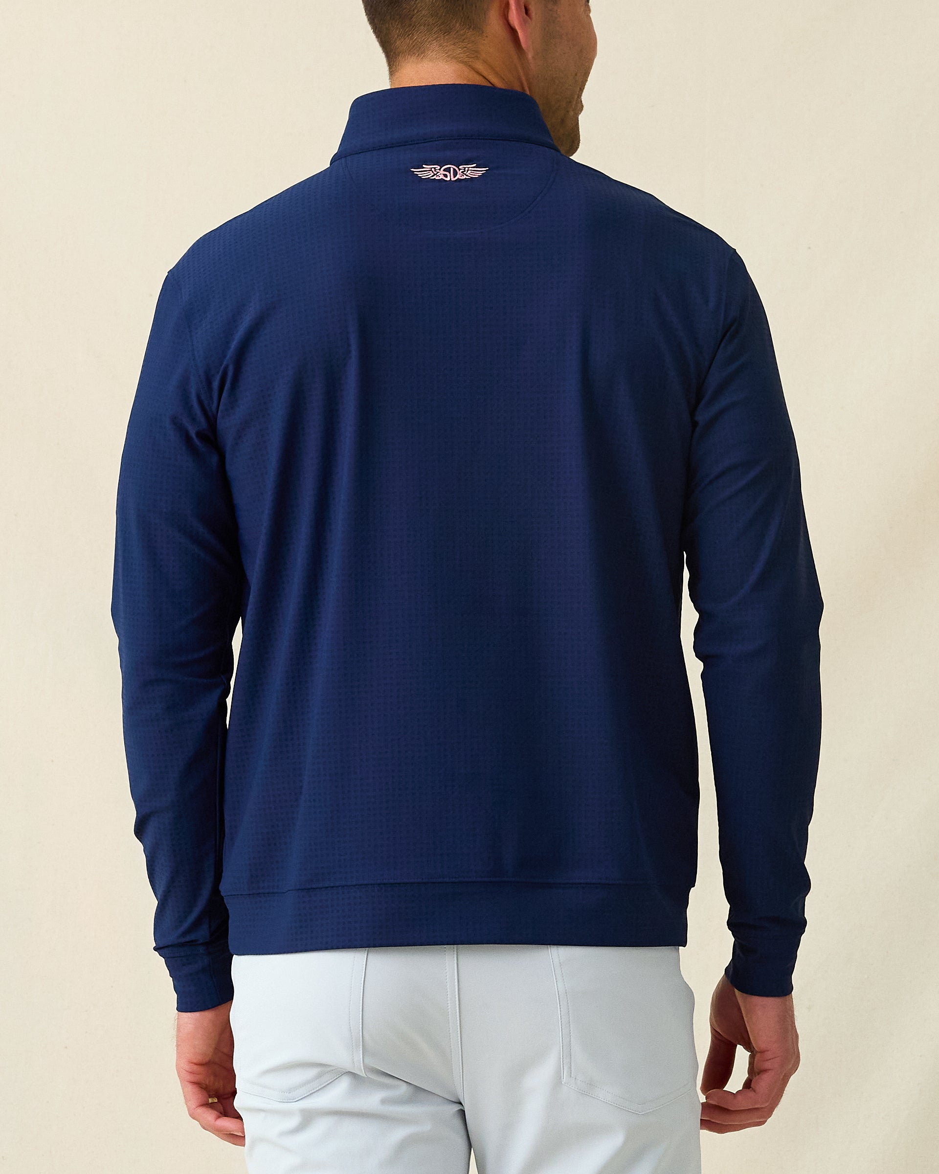 Men's Bel Air Quarter Zip in New Indigo, back model view featuring a navy long sleeve quarter zip pullover with a subtle textured fabric, with an embroidered Straight Down logo at the back collar