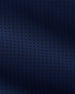 A close-up of dark navy blue textured fabric with a subtle woven geometric pattern.