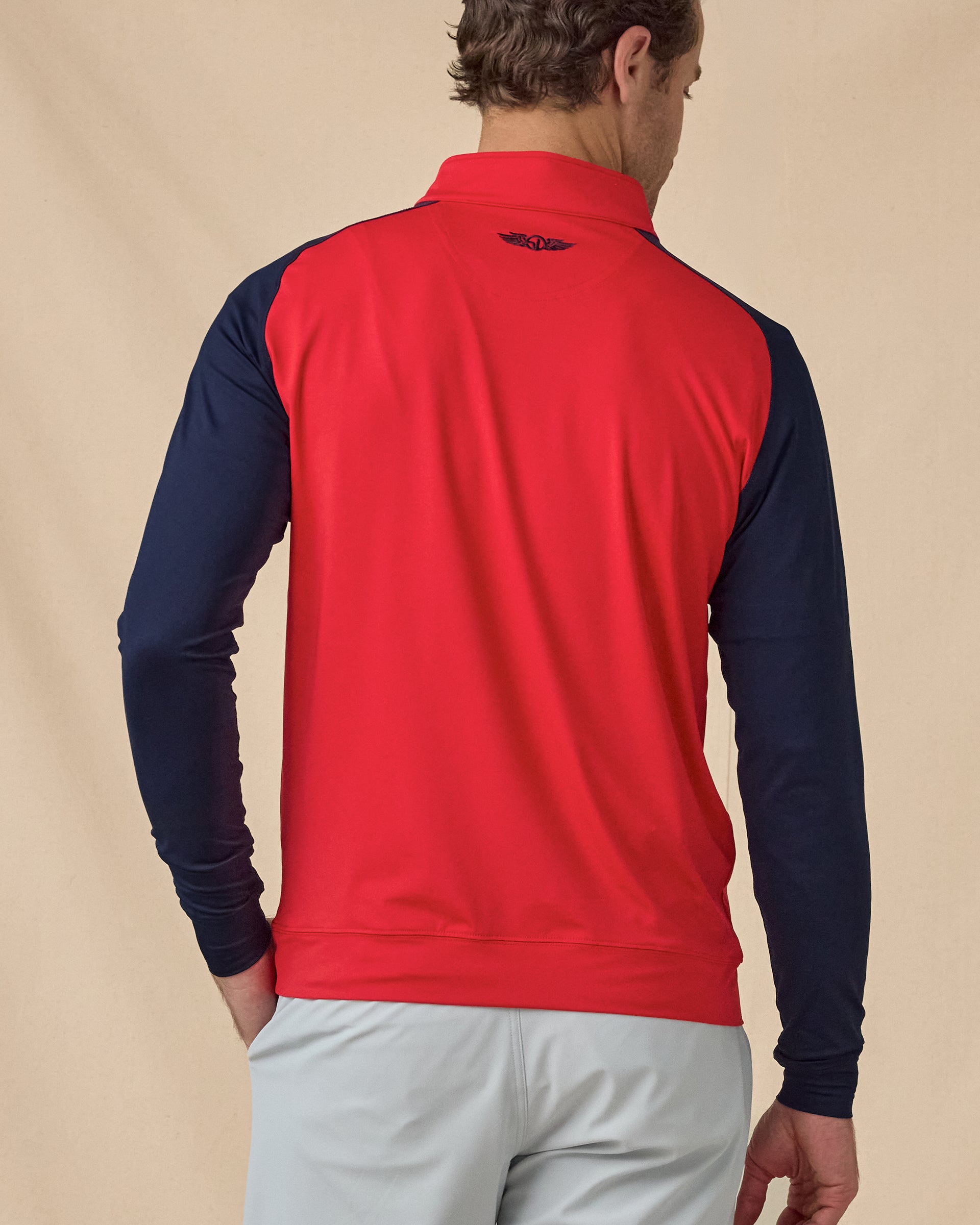 Men’s Falcon Quarter Zip in Flag Red with navy sleeves, back view