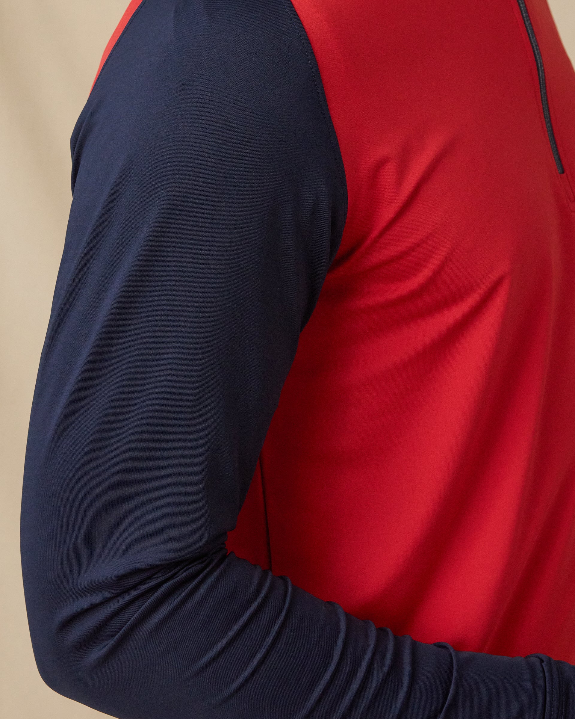 Falcon Quarter Zip in Flag Red with navy sleeves, sleeve detail close-up