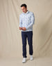 Model wearing the Arlington Quarter Zip in Blue Shade with navy pants and white sneakers.