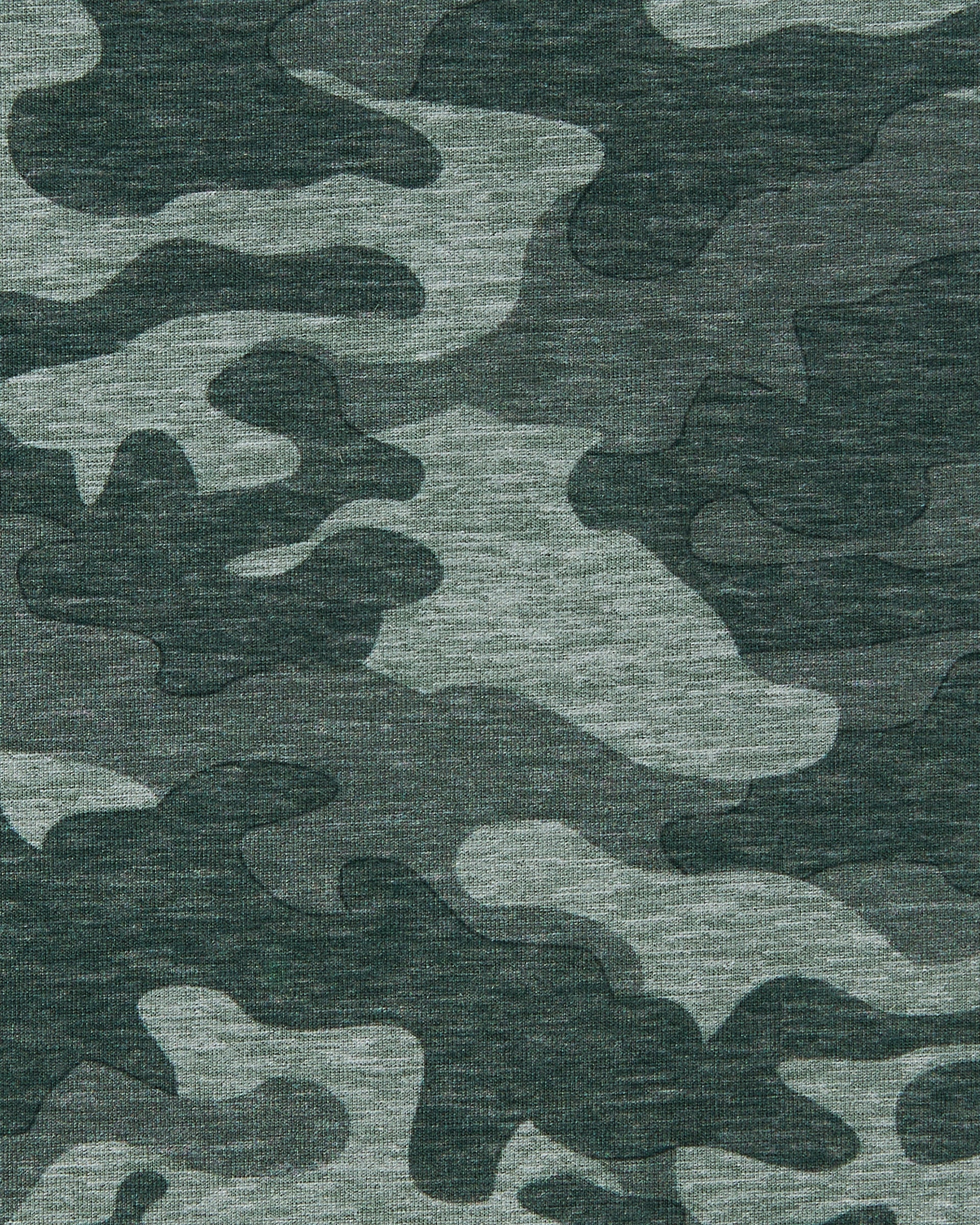 Close-up of the Arlington Quarter Zip in Dark Forest highlighting the green camouflage pattern and fabric texture.
