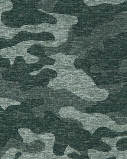 Close-up of the Arlington Quarter Zip in Dark Forest highlighting the green camouflage pattern and fabric texture.