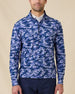 Model wearing the Arlington Quarter Zip in Tidal Blue with a blue camo print