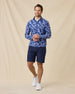 Model styled in the Arlington Quarter Zip in Tidal Blue, navy performance shorts