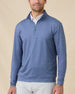 Front view of a man wearing the Mulholland Quarter Zip in Moonlight over a white polo, showing the allover geometric print and stand collar.