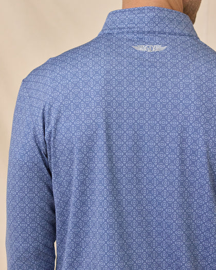 Close-up back view of the Mulholland Quarter Zip in Moonlight showing the geometric print and embroidered logo below the collar.