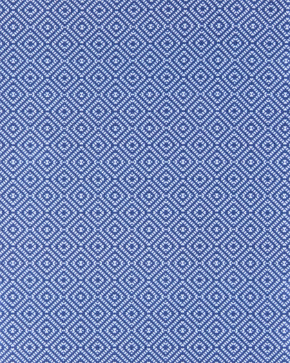 A close-up of a repeating blue and white geometric pattern, likely a woven textile or fabric swatch, filling the entire frame.