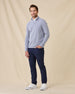 Model wearing the Glendale Quarter Zip in Tidal Blue paired with navy golf pants