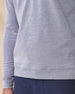 Close-up of the Glendale Quarter Zip in Tidal Blue highlighting the lightweight oxford pique texture and ribbed hem