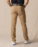 Men's Claremont Five Pocket Twill Pant in British Khaki, back on-model view featuring two patch pockets in warm tan twill fabric, styled with a black t-shirt, black leather belt, and white shoes