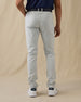 Men's Claremont Five Pocket Twill Pant in Silver, back on-model view featuring two patch pockets in light gray twill fabric, styled with a navy polo, navy leather belt, and white shoes