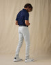 Men's Claremont Five Pocket Twill Pant in Silver, side on-model view featuring a light gray twill fabric, styled with a navy polo, navy leather belt, and white shoes
