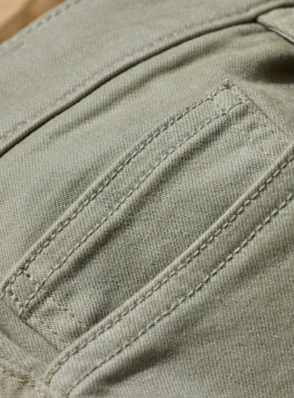 Men's Henderson 5 Pocket Pant in Moss, extreme close-up fabric and pocket detail featuring tonal topstitching and stretch twill texture