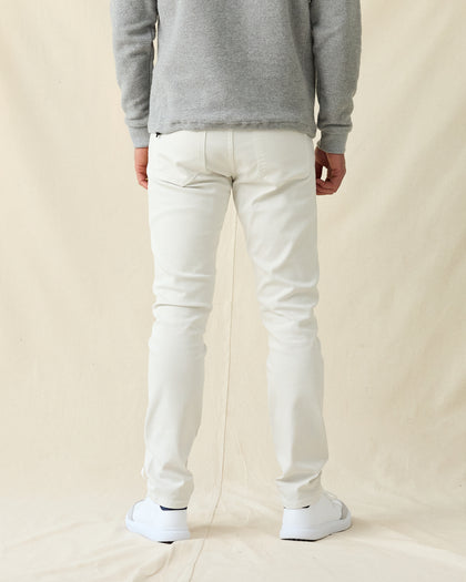 Men's Henderson 5 Pocket Pant in Vapor, back view on model featuring five-pocket styling, paired with a gray sweatshirt and white shoes