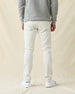 Men's Henderson 5 Pocket Pant in Vapor, back view on model featuring five-pocket styling, paired with a gray sweatshirt and white shoes