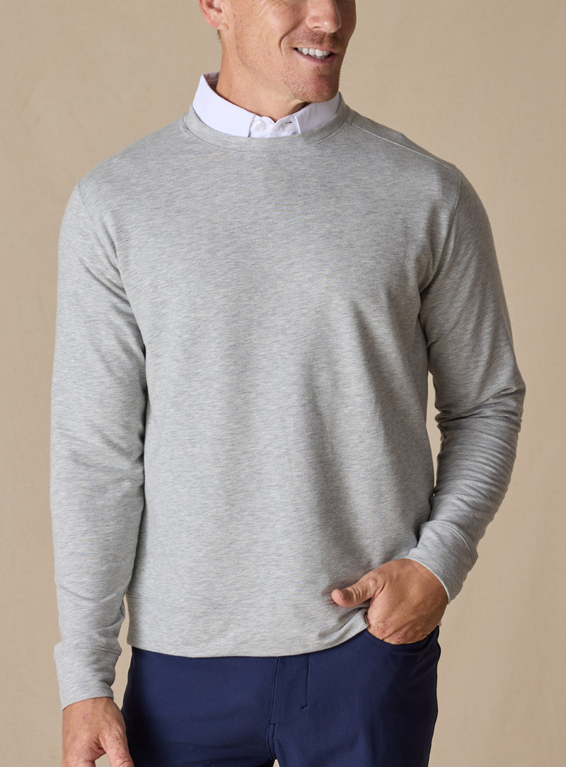 Men's Nathan 2.0 Crew in Light Grey Heather, front view on male model layered over a white collar, paired with navy pants against a neutral backdrop