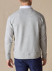 Men's Nathan 2.0 Crew in Light Grey Heather, back view on male model showing embroidered logo at center back neck and ribbed hem, paired with navy pants