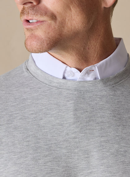 Men's Nathan 2.0 Crew in Light Grey Heather, close-up detail of crew neckline and heathered fabric texture with white polo collar visible underneath