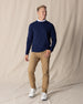 Men's Nathan 2.0 Crew in New Indigo, full-length front view on male model styled with khaki pants and white sneakers against a neutral linen backdrop