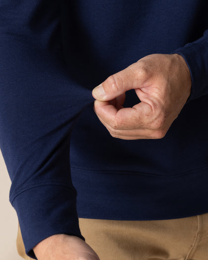 Men's Nathan 2.0 Crew in New Indigo, close-up detail of ribbed hem and soft fabric texture on sleeves