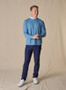 Men's Nathan 2.0 Crew in Petrol, full-length front view on male model styled with navy pants and white golf shoes against a neutral linen backdrop