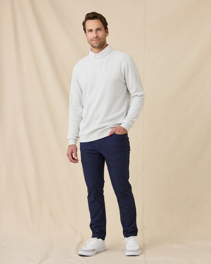 Model wearing the Hopkins Crew in Heather with navy pants and white sneakers.