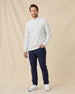 Model wearing the Hopkins Crew in Heather with navy pants and white sneakers.