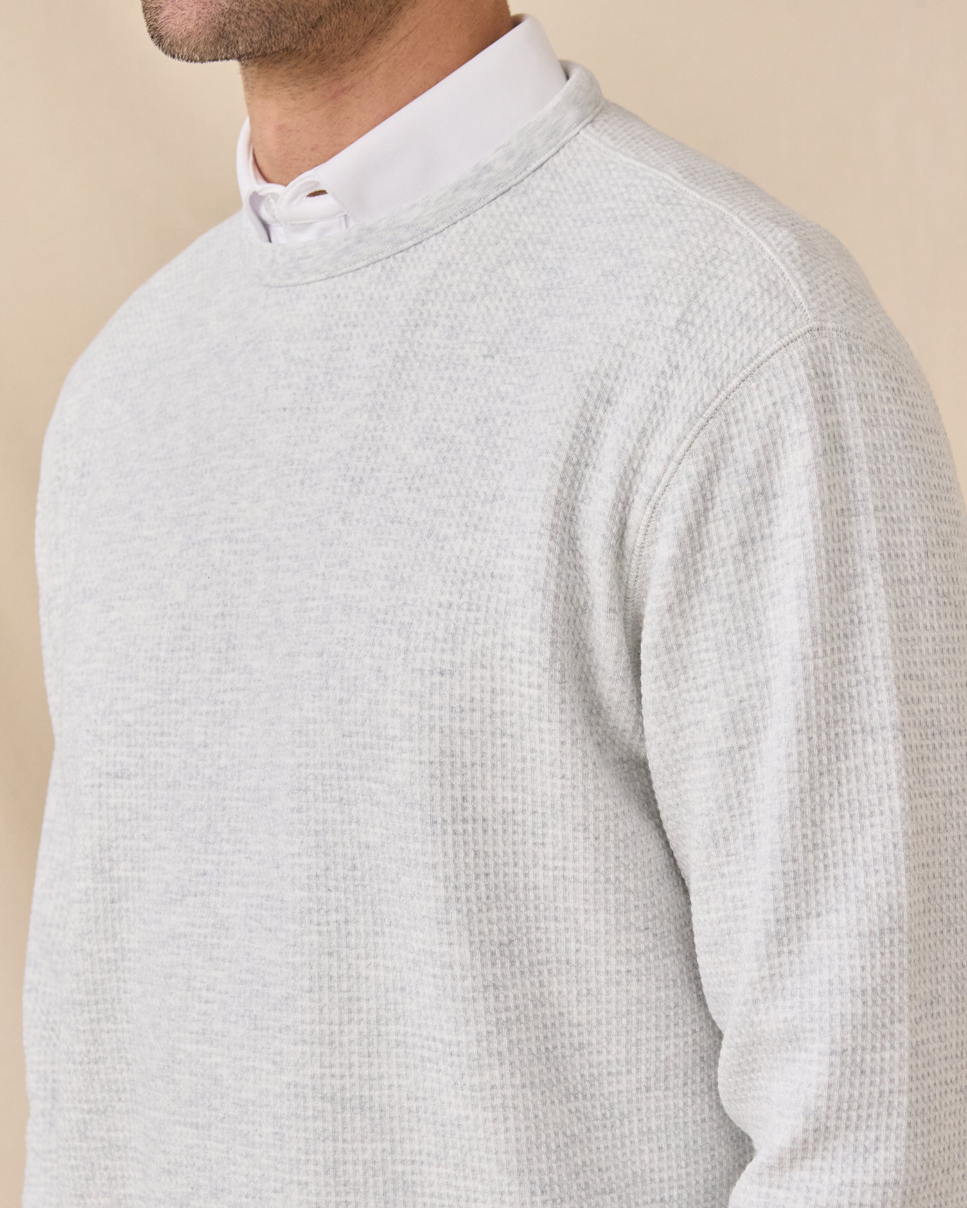 Close-up of the Hopkins Crew in Heather highlighting the textured waffle knit and crew neckline.