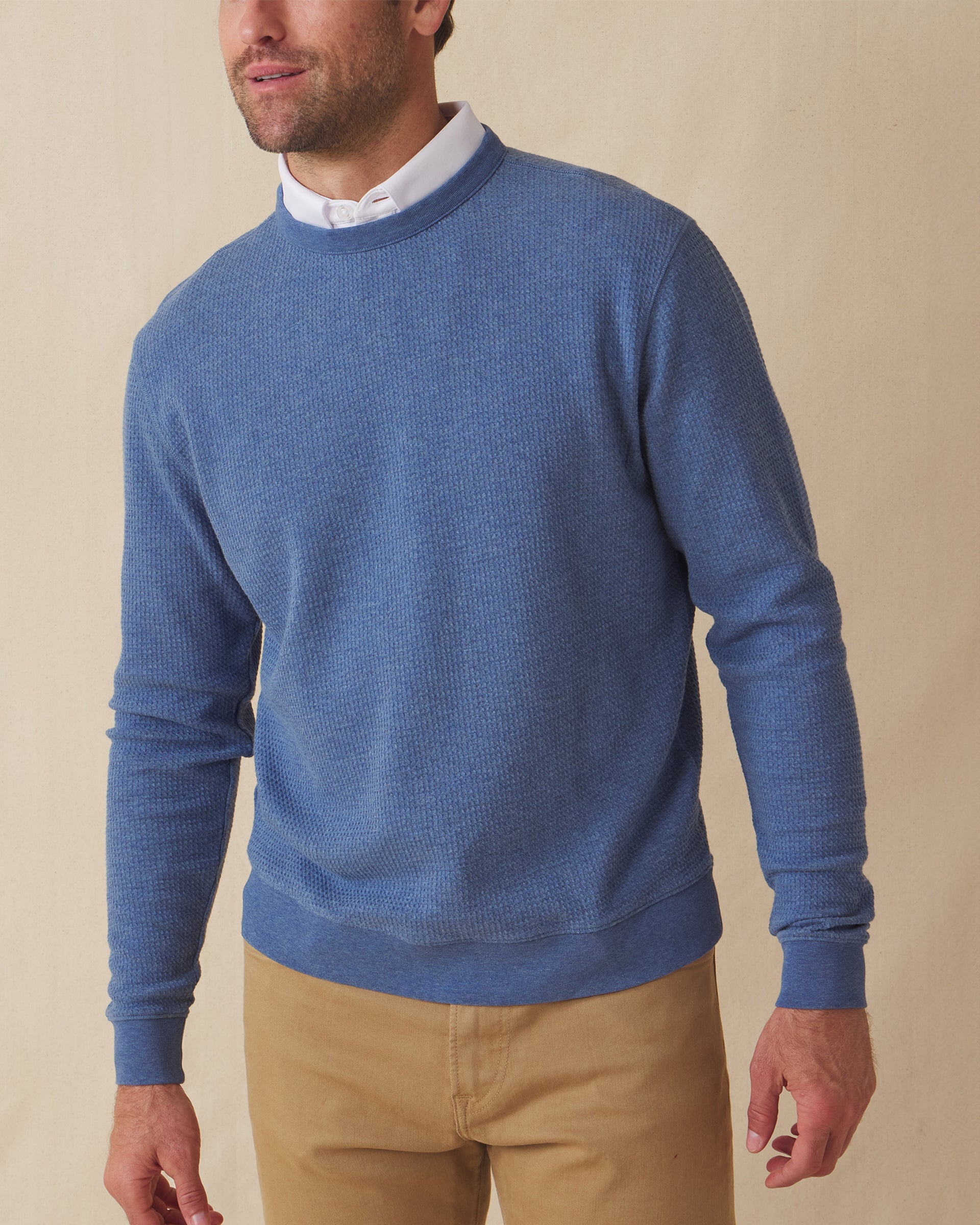 Men's Hopkins Crew in Moonlight, front view on model featuring a waffle-knit texture with ribbed crewneck, layered over a white polo, paired with khaki pants