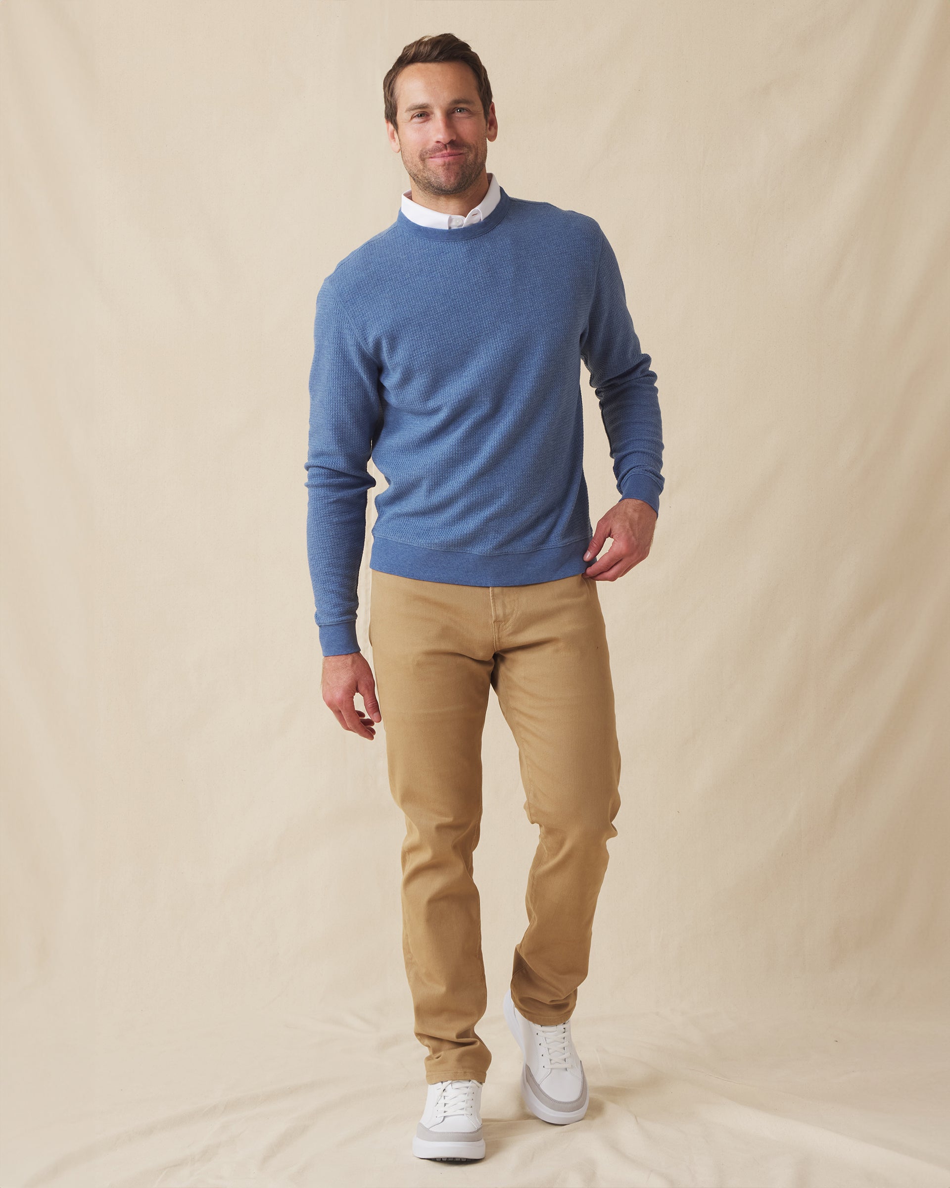Men's Hopkins Crew in Moonlight, full length front view on model featuring a waffle-knit texture with ribbed crewneck, layered over a white polo, paired with khaki pants and white shoes