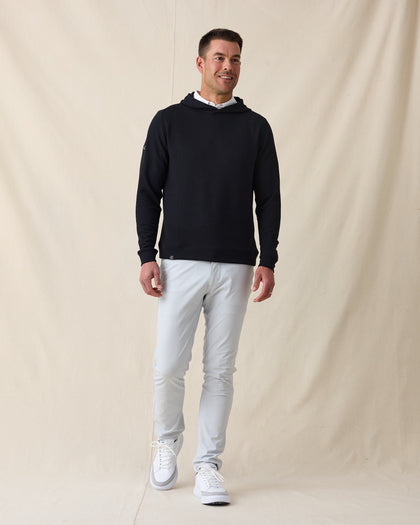 Men’s Gridlock Hoodie in black, full-body on-model view styled with light pants