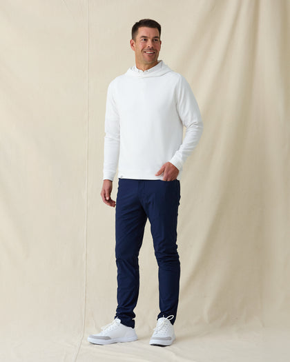 Men’s Gridlock Hoodie in white, full-body on-model view styled with navy pants