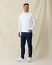 Men’s Gridlock Hoodie in white, full-body on-model view styled with navy pants