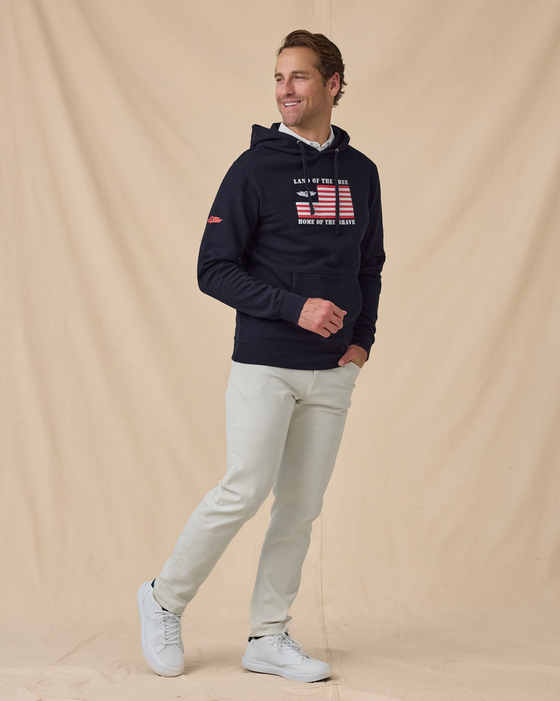 Freedom Hoodie in Navy, styled full outfit view with light pants