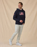 Freedom Hoodie in Navy, styled full outfit view with light pants