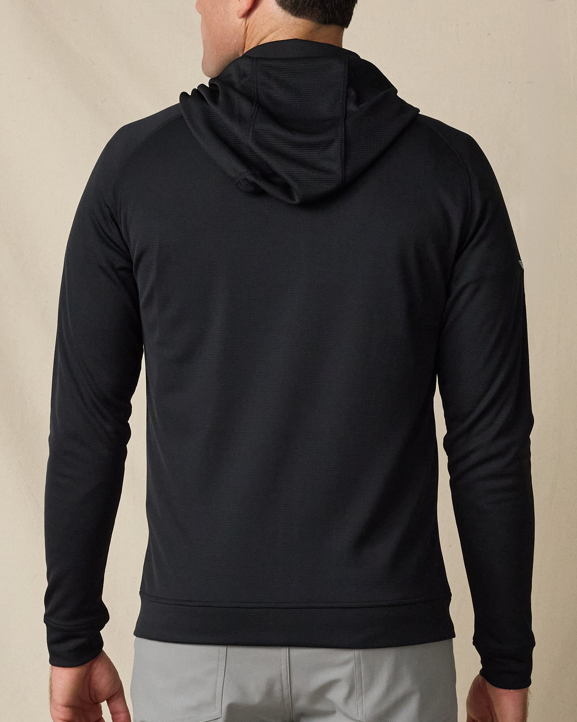 Rear view of the Condor Full Zip Hoodie in Black, showing the streamlined fit, hood, and long sleeves.