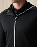 Close-up of the Condor Full Zip Hoodie in Black, featuring a textured finish, contrast white zipper, and hood.