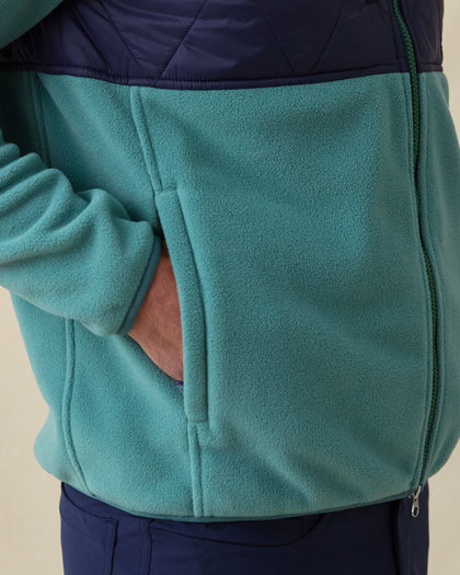 Men's Okemo Hybrid Fleece Jacket in Sage, close-up side view on model highlighting the fleece hand pocket on the sage lower body